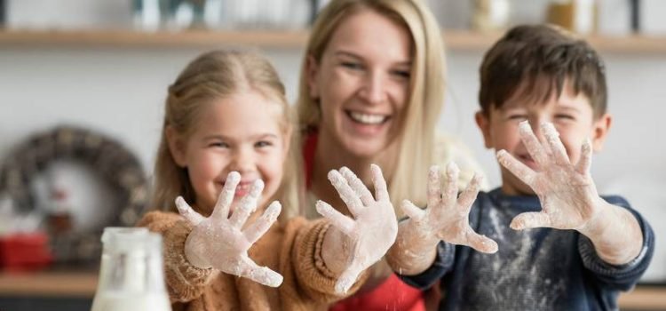 Children showing dirty hands after baking